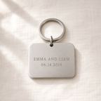 Stainless steel keychain engraved EMMA AND LIAM with a date