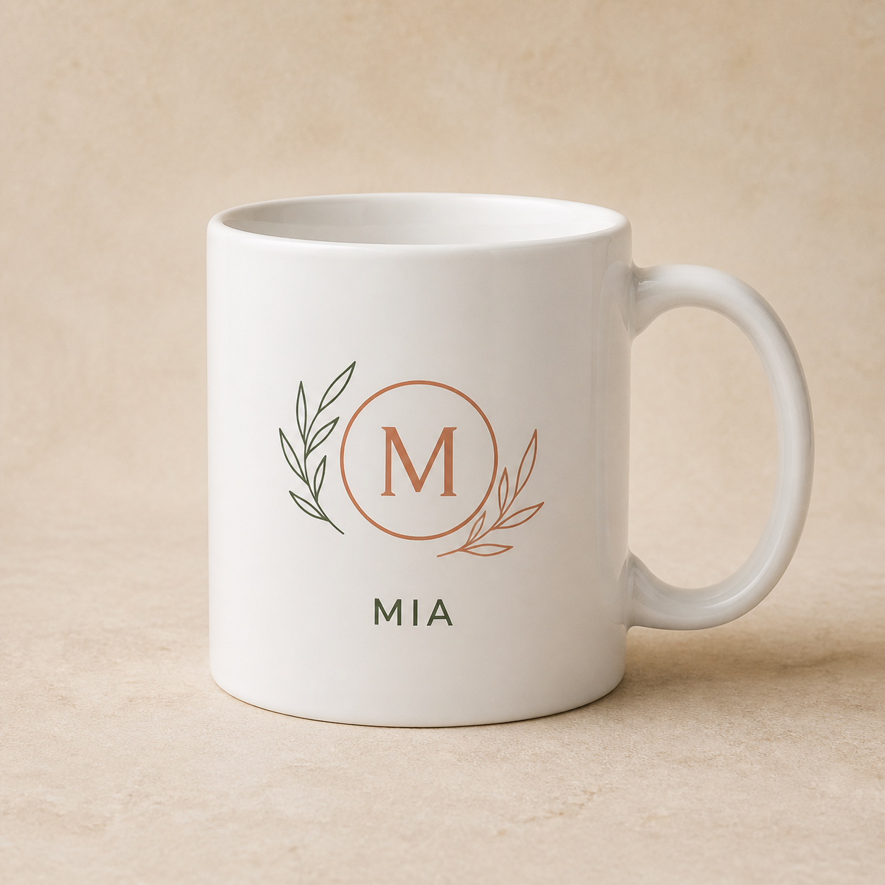 Personalized white ceramic mug with botanical monogram and sample name MIA