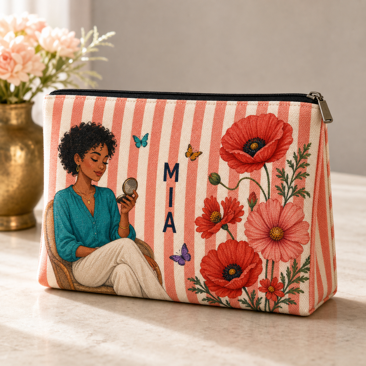 Coral striped personalized makeup pouch with illustrated woman, red birth flowers, butterflies and sample name MIA
