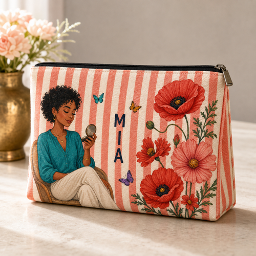 Coral striped personalized makeup pouch with illustrated woman, red birth flowers, butterflies and sample name MIA