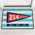 Aqua and white striped personalized dorm doormat with coral varsity pennant, room number 214 and sample names MIA, AVA and LEO